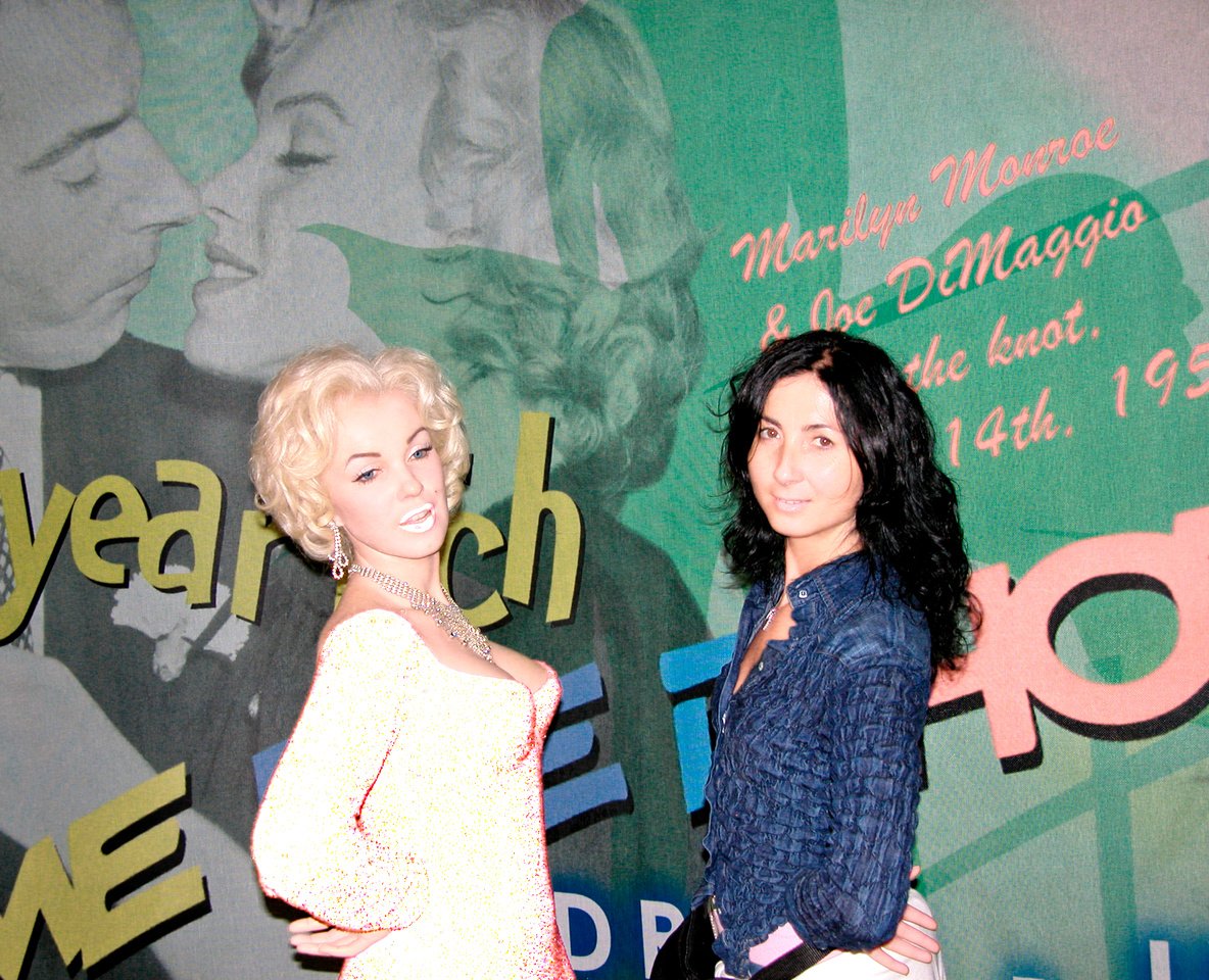 Girl Poses Alongside Marylin Monroe inside Wax Museum in NYC